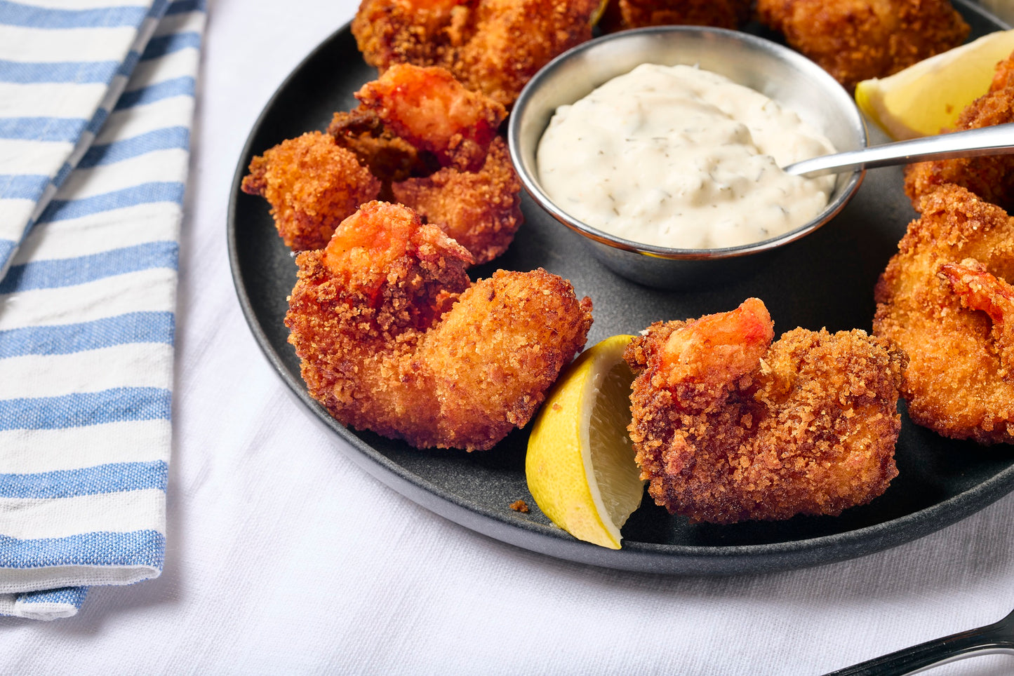 A plate of fried shrimp served with St. Elmo tartar sauce.