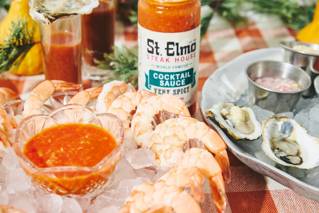 a platter of chilled shrimp with St. Elmo Cocktail Sauce for dipping
