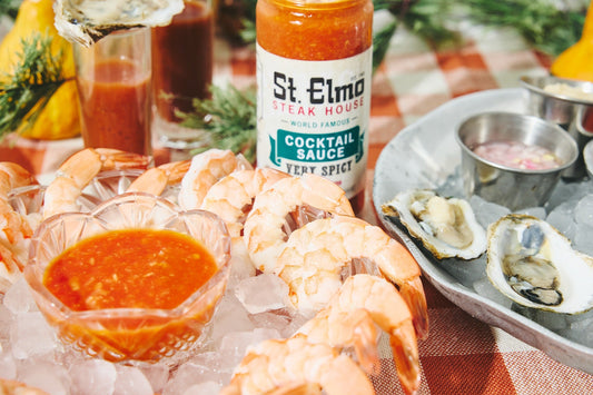a platter of chilled shrimp with St. Elmo Cocktail Sauce for dipping