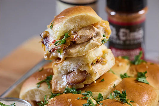Chicken bacon sliders topped with melted cheddar cheese and creamy horseradish sauce on Hawaiian rolls.