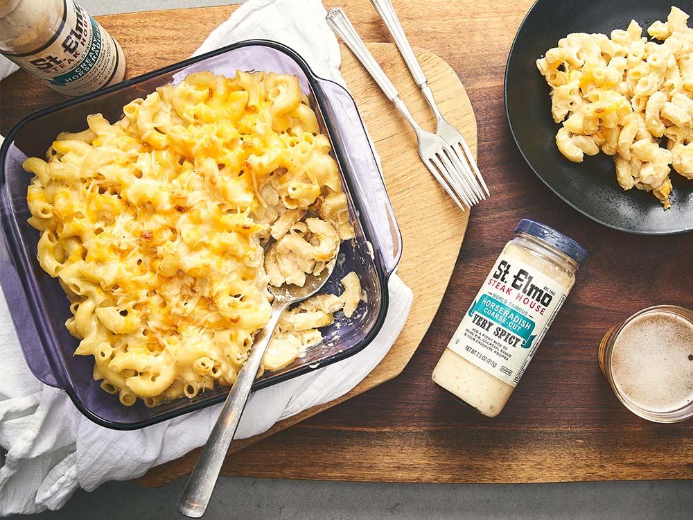 Creamy white cheddar macaroni and cheese baked until golden brown and served beside St. Elmo Creamy Horseradish sauce.