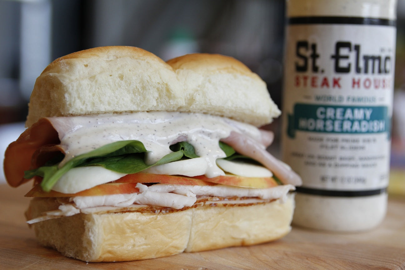 Creamy horseradish atop a cold cut sandwich